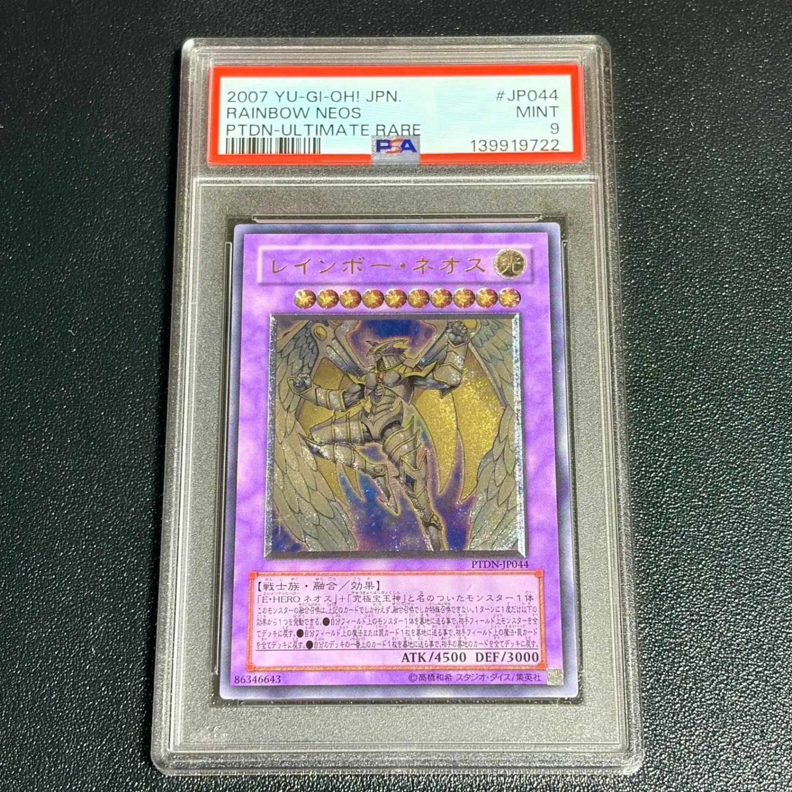 PSA-graded "Rainbow Neos" Yu-Gi-Oh trading card (PTDN-JP044) in a clear plastic slab showing the card front and PSA label.