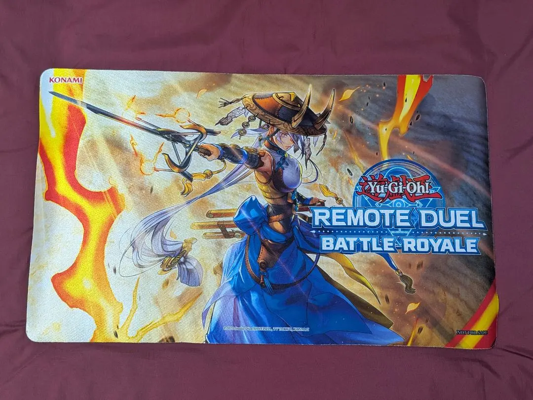 Yu-Gi-Oh! Swordsoul of the Abyss Remote Duel polyester playmat laid flat showing character artwork and "Remote Duel Battle Royale" text.