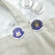 Two round acrylic hair clips from the Yu☆Gi☆Oh ZEXAL × COLLABOCAFEHONPO BLANC 2026 set showing character designs attached to a fabric strap.