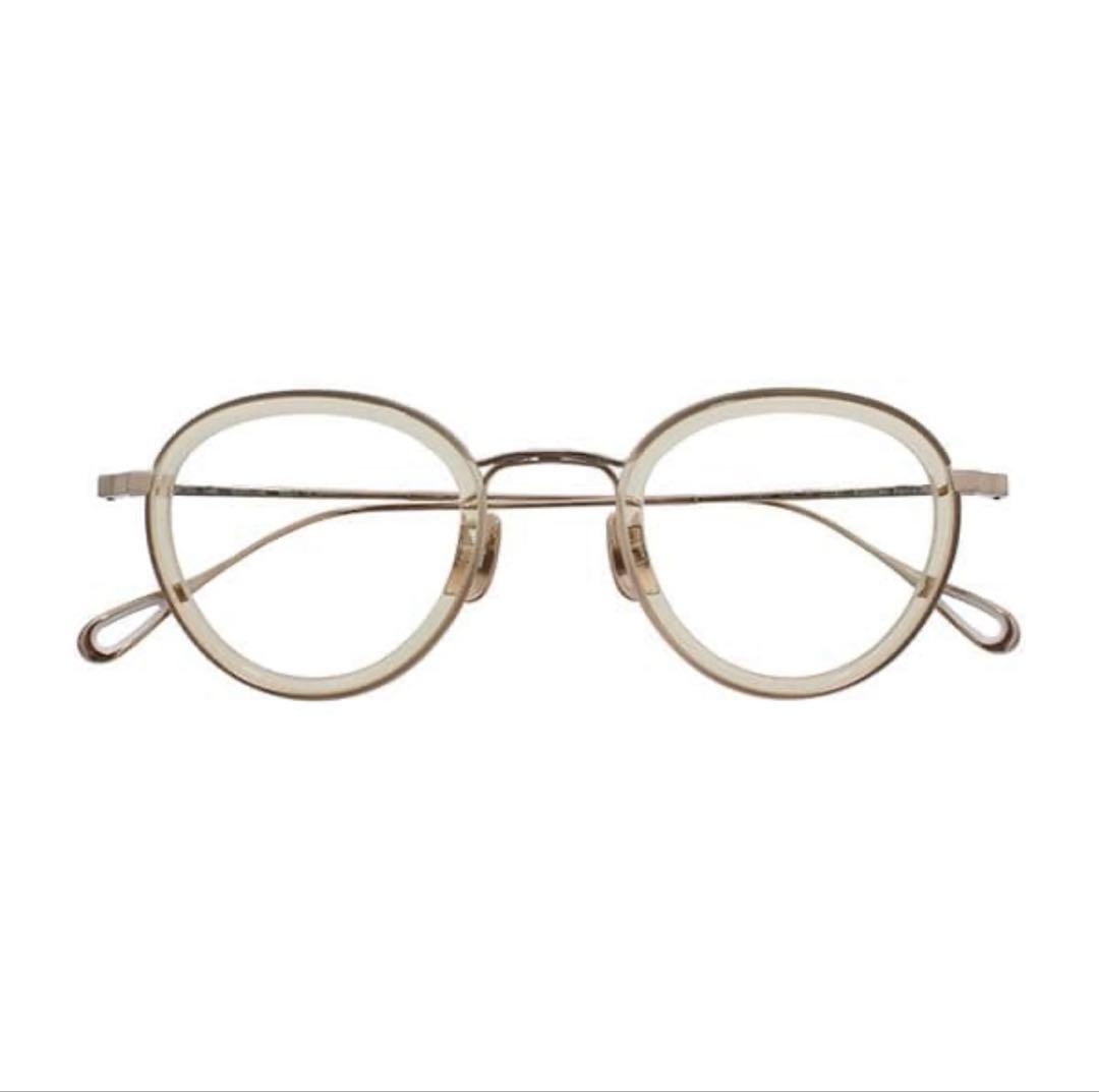 Front view of the Yuichi Toyama U-141 eyeglasses showing round lenses and a translucent plastic frame.
