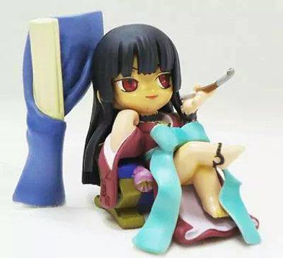 Photograph of the trading figure Ichihara Yuko (xxxHOLiC) seated wearing a kimono with long black hair, red eyes, and holding a small pipe.