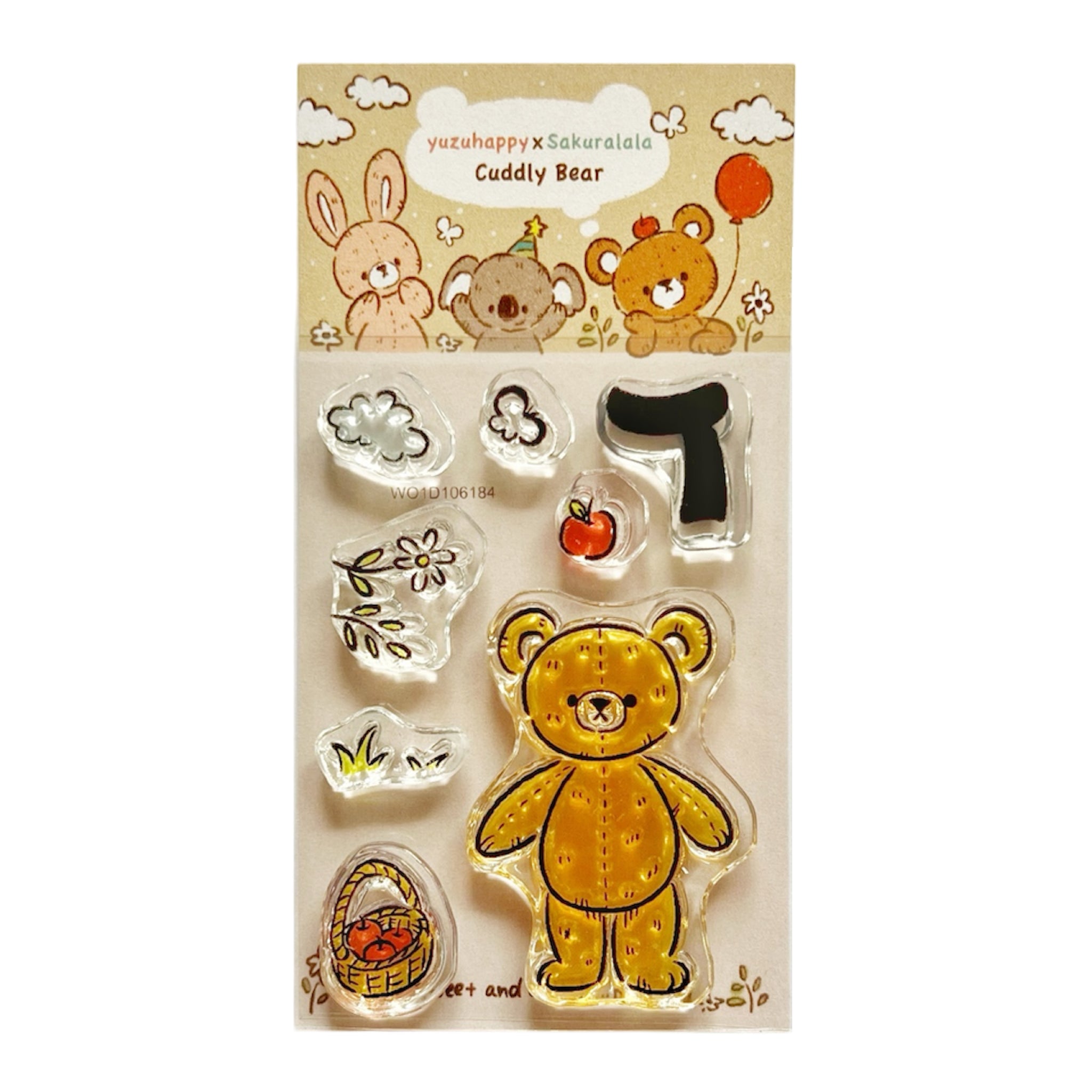 Clear plastic stamps of a teddy bear and small shapes on a backing card labeled Yuzuhappy x Sakuralala Cuddly Bear.