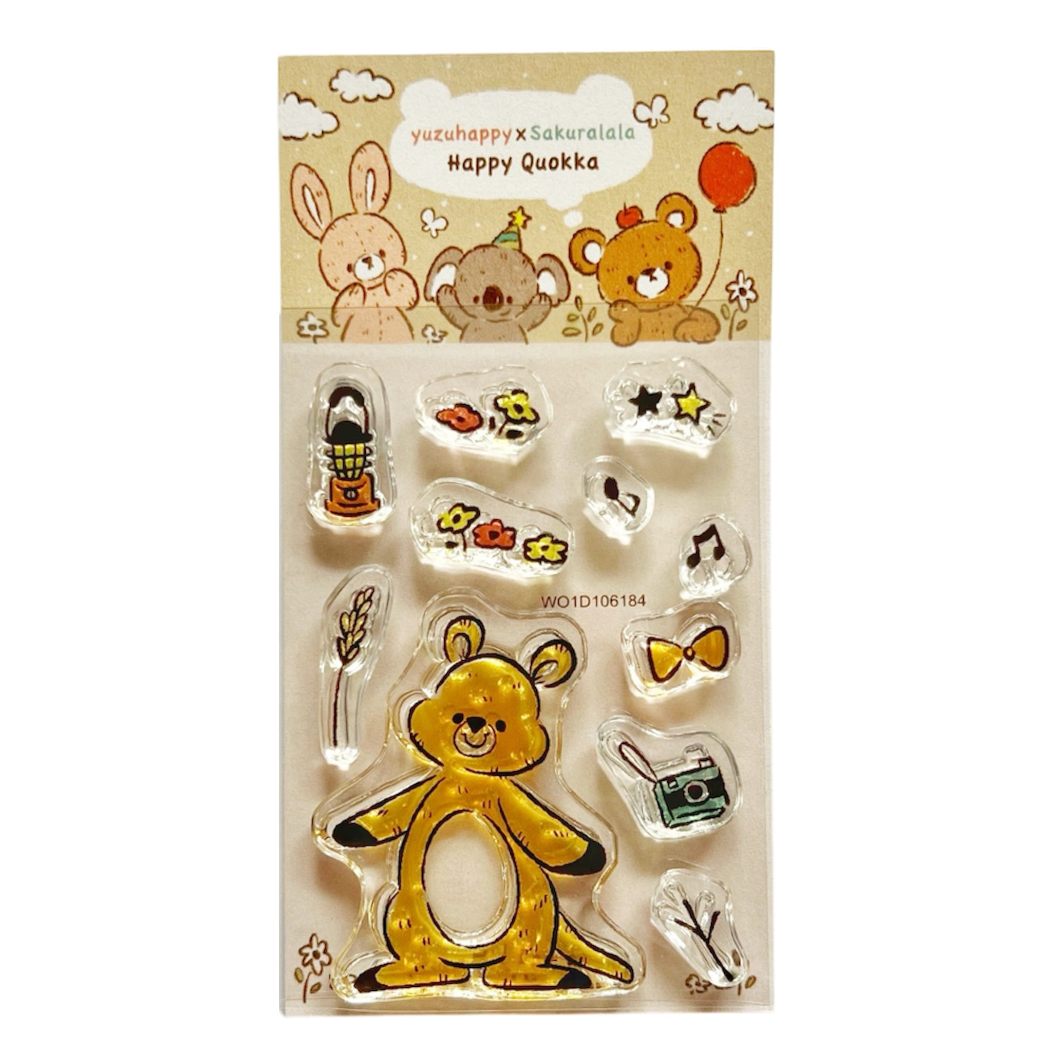 Plastic stamp set on a backing card showing a smiling quokka character and several small decorative stamps, labeled "yuzuhappy x sakuralala Happy Quokka".