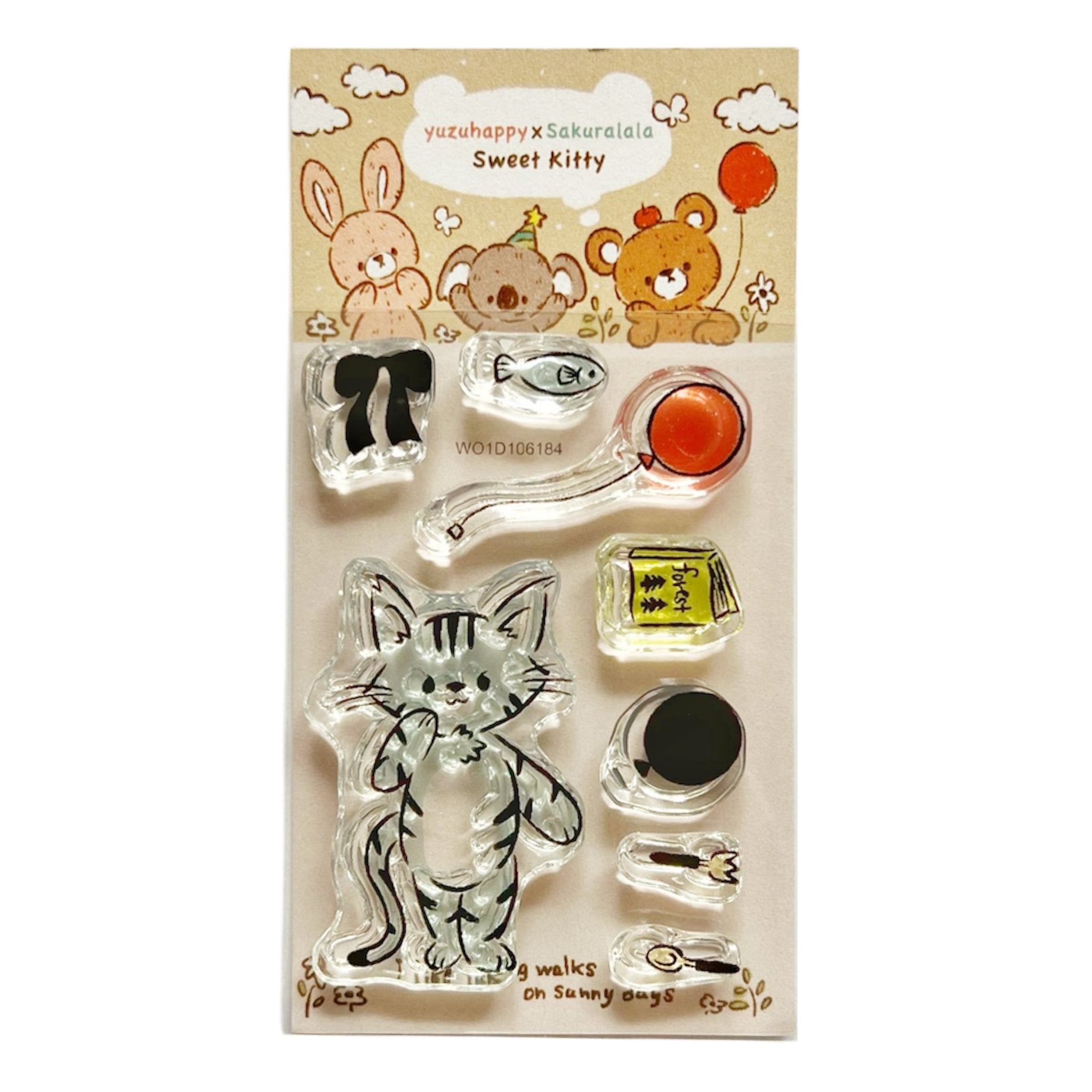Packaged Yuzu Happy x Sakuralala Sweet Kitty clear plastic stamp set with a large kitten stamp and several small accessory stamps on illustrated backing.