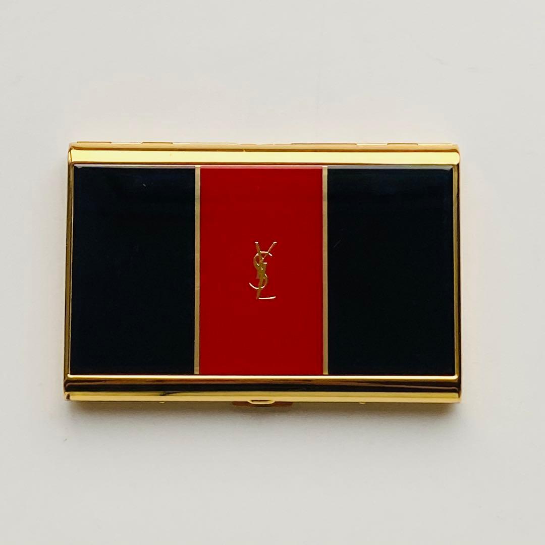 Yves Saint Laurent cigarette/card case with gold trim, black and red enamel panels and a central YSL logo.