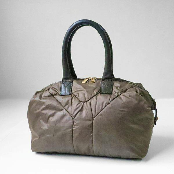 Front view of a khaki Y-quilted nylon Yves Saint Laurent mini Boston handbag with black handles.