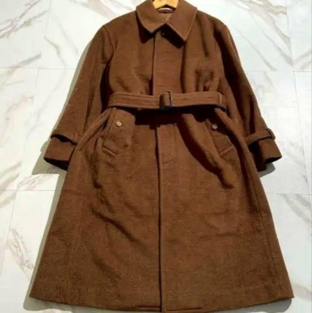 Brown long Yves Saint Laurent men's wool trench coat laid flat showing the front, collar, belt, and pockets.