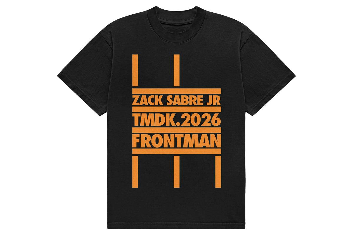 Front view of a black cotton T-shirt with orange stacked bars and the printed text "ZACK SABRE JR TMDK.2026 FRONTMAN".