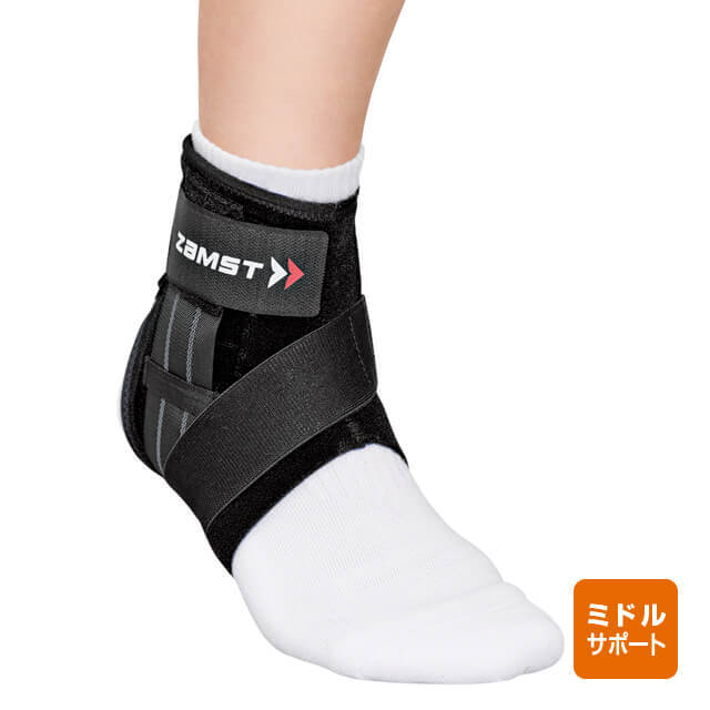 A Zamst A1 Short ankle supporter worn on a foot with a white sock.