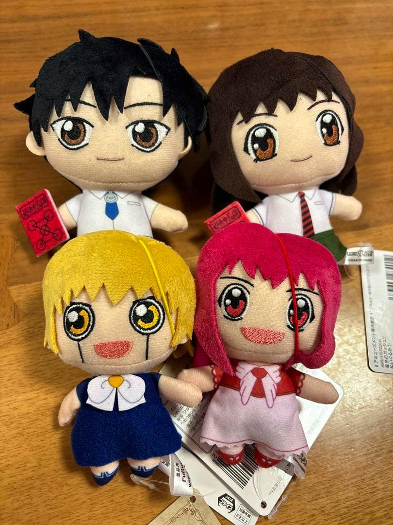Four Konjiki no Gash (Gash Bell) plush toys (prize items) arranged on a wooden surface, two in back and two in front.