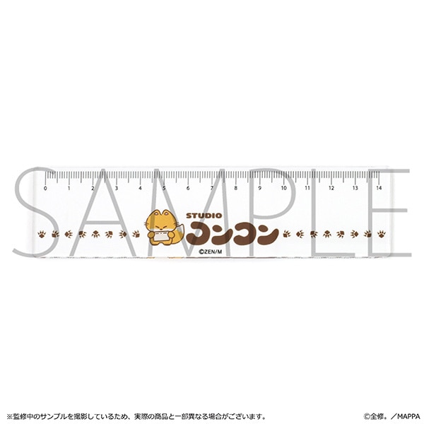 A clear acrylic ruler with centimeter markings and a small Studio Koncon character printed across it.