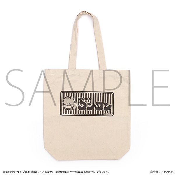 Beige reusable tote bag with long handles and a black rectangular printed logo and character on the front.