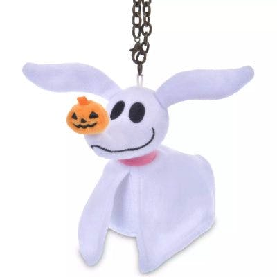 White Zero plush keychain from The Nightmare Before Christmas with a small pumpkin on its nose, hanging from a metal chain.