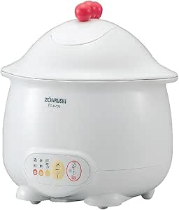 Front view of the white Zojirushi electric egg steamer with lid, red knob, and front control panel.