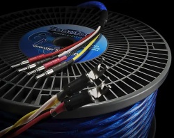 Spool of blue Zonotone speaker cable with multiple terminated leads showing red and black connectors.