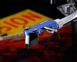 Zonotone Z SHELL 10 blue head shell with cartridge and stylus mounted on a record player's tonearm.