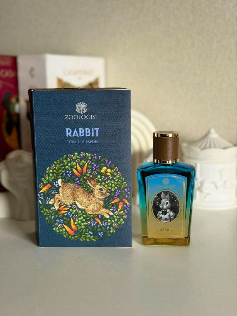 A Zoologist Rabbit perfume box standing next to the Rabbit perfume bottle on a tabletop.