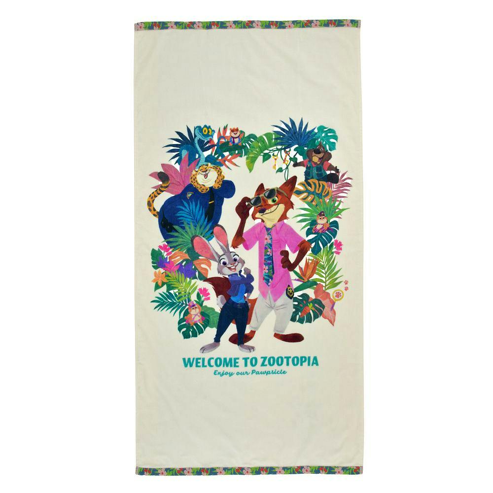 A cotton bath towel showing a tropical Zootopia character print with the text "WELCOME TO ZOOTOPIA".