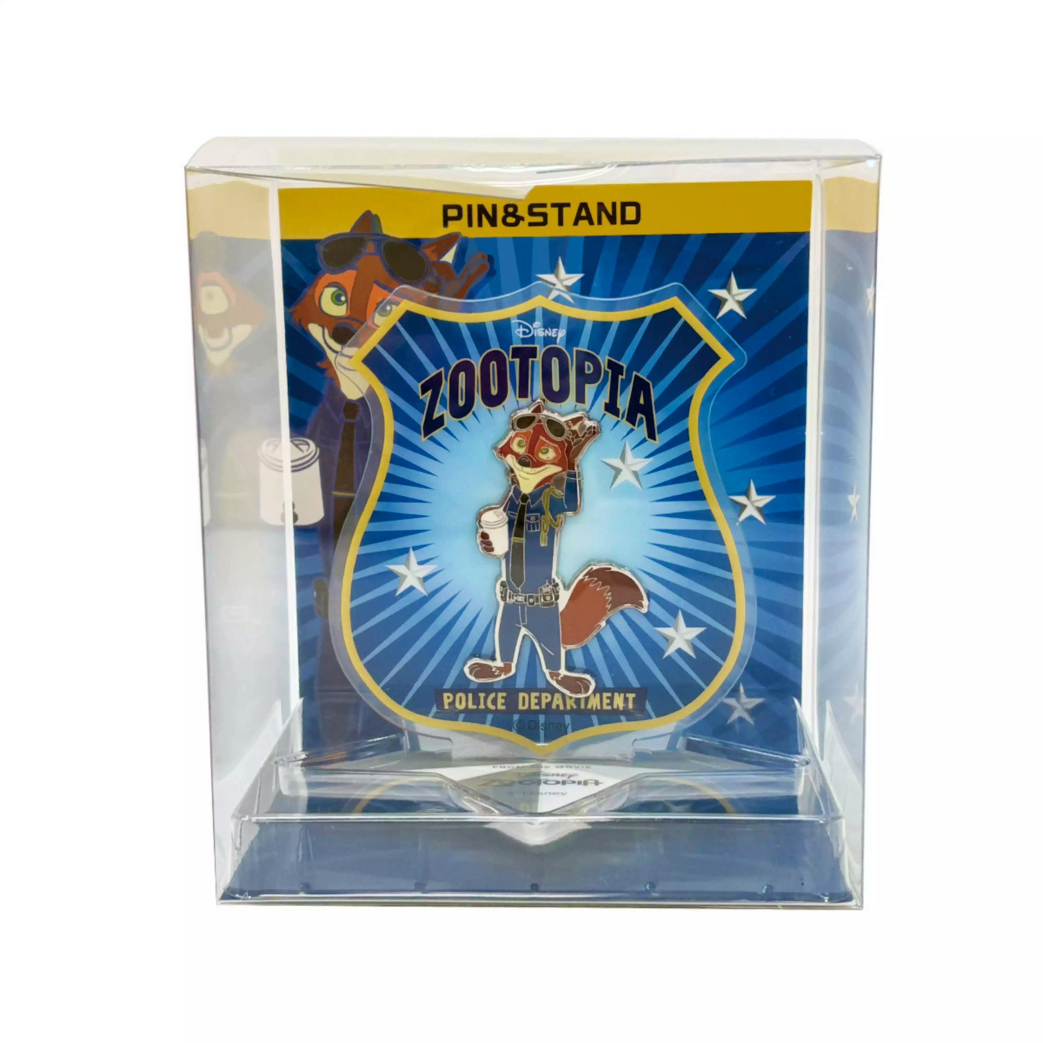 Nick Wilde enamel pin from Zootopia mounted on a blue "Police Department" backing inside a clear plastic display case.