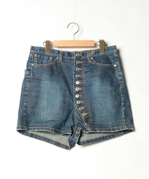 Front view of ZUCCa navy denim women's shorts (size M) with a visible button fly hanging on a hanger.